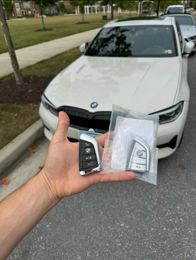 BMW 3 Series smart key connected to a programming tool