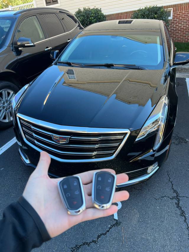 Cadillac smart key fob being paired to the vehicle