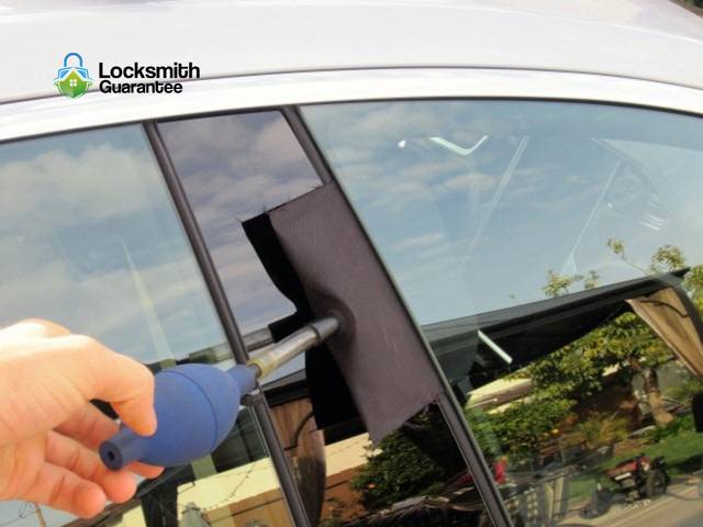 Entry tool eased past the weather seal of a car door