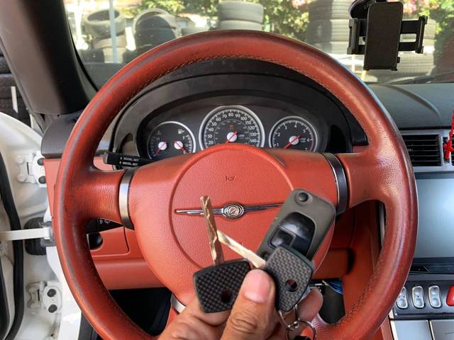 Replacement Chrysler key being written into the vehicle's system
