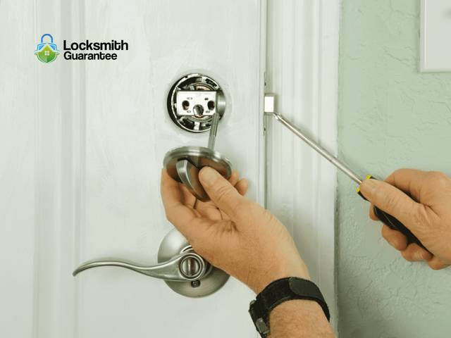 Deadbolt being set into the bore of a house door