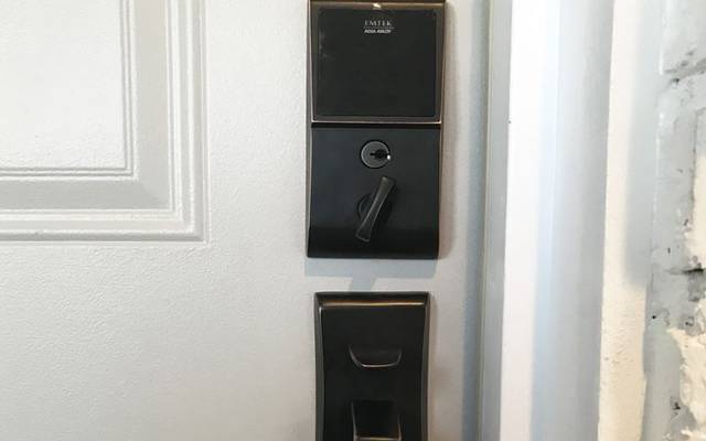 Emtek smart keypad deadbolt on a finished door