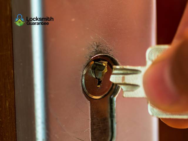 Fragment of a key being lifted clear of a keyway
