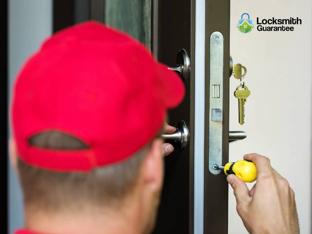 Locksmith at work on a residential door