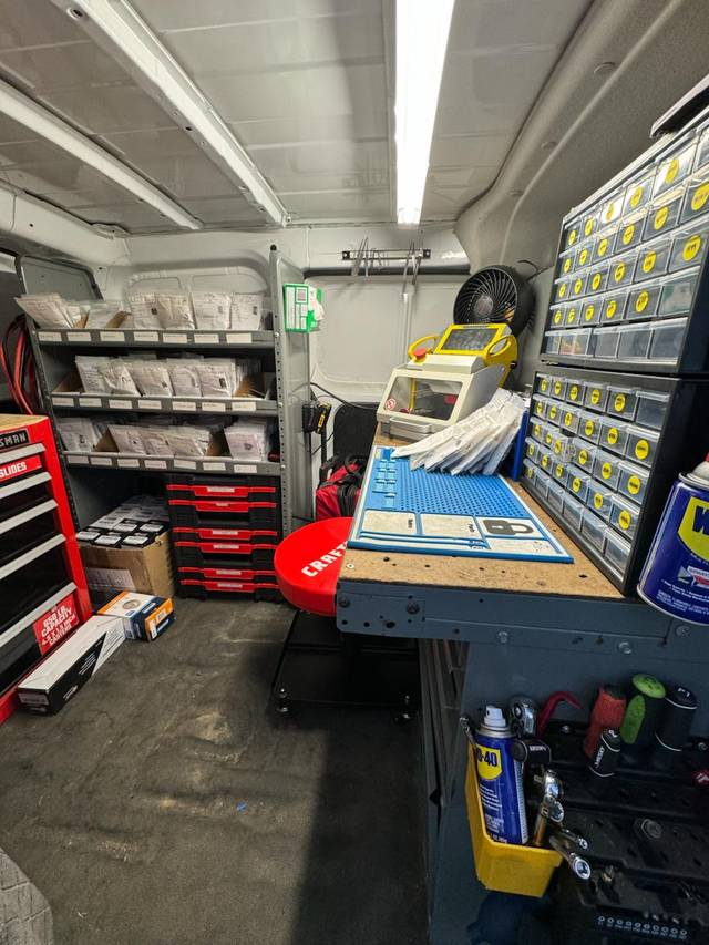 Key cutting machine mounted in the back of the service van
