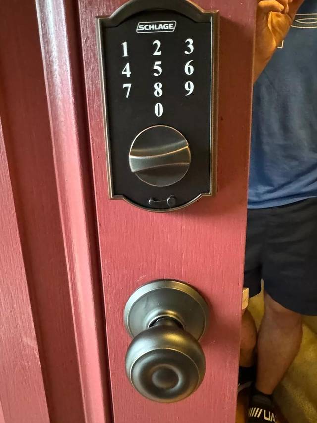 Schlage keypad deadbolt fitted above the handle set