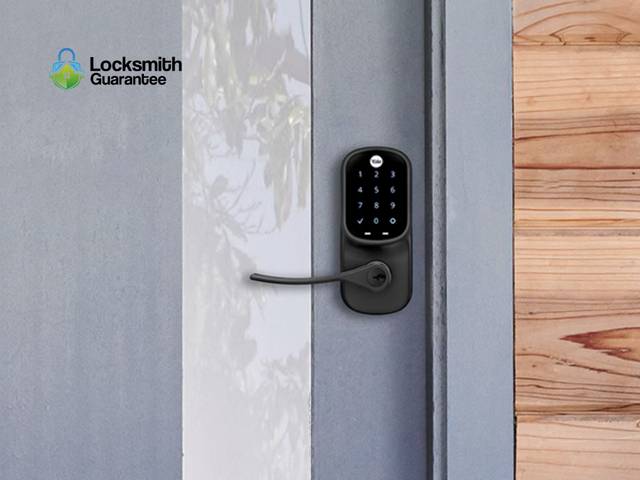 Smart deadbolt going onto a door, interior module still open
